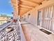 Long covered porch with access to front door and desert landscaping at 13602 S Garnet Rd, Buckeye, AZ 85326