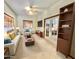 Virtually staged living room with comfy sofa and built-in shelving at 13602 S Garnet Rd, Buckeye, AZ 85326