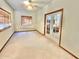 Small spare bedroom with French doors and carpet at 13602 S Garnet Rd, Buckeye, AZ 85326