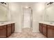 Double vanity bathroom with tiled floors and a shower at 13608 N 150Th Ln, Surprise, AZ 85379