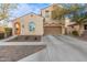 Two-story house with tan exterior, red-tiled accents, and a two-car garage at 13608 N 150Th Ln, Surprise, AZ 85379