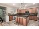 Modern kitchen with granite countertops and wood cabinets at 13608 N 150Th Ln, Surprise, AZ 85379