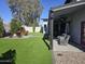 Large backyard with artificial turf, lounge seating, and a covered patio perfect for entertaining at 14426 N 39Th Way, Phoenix, AZ 85032