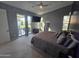 Bright bedroom with sliding glass doors opening to backyard, and a large bed at 14426 N 39Th Way, Phoenix, AZ 85032