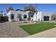 Contemporary house with a red door and artificial turf at 14426 N 39Th Way, Phoenix, AZ 85032