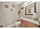 Clean bathroom with granite countertop, decorative mirror, and tile flooring at 15791 W Mohave St, Goodyear, AZ 85338