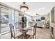 Elegant dining area with glass-top table and access to the backyard at 15791 W Mohave St, Goodyear, AZ 85338