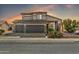 Two-story house with a three-car garage and desert landscaping at 15791 W Mohave St, Goodyear, AZ 85338