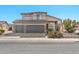 Two-story house with a three-car garage and desert landscaping at 15791 W Mohave St, Goodyear, AZ 85338