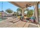 Covered patio with ceiling fan and comfortable seating at 15791 W Mohave St, Goodyear, AZ 85338