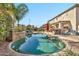 Stunning kidney shaped pool with a large backyard at 15791 W Mohave St, Goodyear, AZ 85338