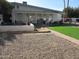 Artificial turf, gravel, and a walkway lead to the house from the backyard at 16809 N Meadow Park Dr, Sun City, AZ 85351