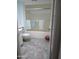 Bathroom with tub and shower, and tiled floor at 16809 N Meadow Park Dr, Sun City, AZ 85351