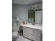 Clean bathroom with white vanity and large mirror at 16809 N Meadow Park Dr, Sun City, AZ 85351