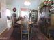 Formal dining room with wooden table and hutch at 16809 N Meadow Park Dr, Sun City, AZ 85351