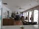 Kitchen view of Gathering room with fireplace and seating at 16809 N Meadow Park Dr, Sun City, AZ 85351