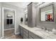 Bathroom featuring dual sinks with granite countertop and tiled floors with adjacent closet at 17318 E Quail Ridge Dr, Fountain Hills, AZ 85268