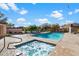 Community pool and spa offer relaxation, complemented by lush greenery under a beautiful sky at 17318 E Quail Ridge Dr, Fountain Hills, AZ 85268