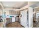 Bright kitchen featuring grey cabinetry, modern appliances and a breakfast bar overlooking the backyard at 17318 E Quail Ridge Dr, Fountain Hills, AZ 85268