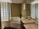 Bathroom features a corner soaking tub and double vanity at 17790 N 66Th Ln, Glendale, AZ 85308