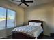 Cozy bedroom with a double bed and large window at 17790 N 66Th Ln, Glendale, AZ 85308