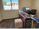 Home office features a large desk and comfortable chair at 17790 N 66Th Ln, Glendale, AZ 85308