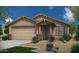 Single-story home with a two-car garage and desert landscaping at 18173 W Cielo Grande Ave, Surprise, AZ 85387