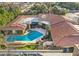 Aerial view showcasing a large home with solar panels and a pool at 2 W Keim Dr, Phoenix, AZ 85013