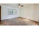 Spacious bedroom with plantation shutters and wall-to-wall carpet at 2 W Keim Dr, Phoenix, AZ 85013