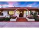 Front entryway with arched detail and attractive landscaping at 2 W Keim Dr, Phoenix, AZ 85013