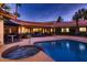 Luxury pool and spa with tiled accents and patio seating at 2 W Keim Dr, Phoenix, AZ 85013