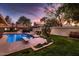 Relaxing pool area with diving board, surrounded by a beautifully landscaped yard at 2 W Keim Dr, Phoenix, AZ 85013