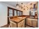 Wet bar with copper countertop and wood cabinetry at 2 W Keim Dr, Phoenix, AZ 85013