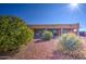 House exterior and backyard view with desert plants at 20040 W Hunter Dr, Wittmann, AZ 85361