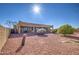 Large backyard with gravel and desert landscaping at 20040 W Hunter Dr, Wittmann, AZ 85361