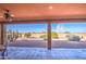 Spacious backyard patio with desert landscaping and seating area at 20040 W Hunter Dr, Wittmann, AZ 85361