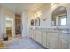 Elegant bathroom with granite countertops, dual sinks, and a large shower at 20040 W Hunter Dr, Wittmann, AZ 85361