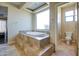 Spa-like bathroom with a large soaking tub and separate shower at 20040 W Hunter Dr, Wittmann, AZ 85361