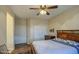 Spacious bedroom with double closet and ceiling fan at 20040 W Hunter Dr, Wittmann, AZ 85361