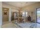 Charming dining room features a rustic wooden table and chairs at 20040 W Hunter Dr, Wittmann, AZ 85361