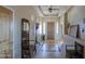 Bright entryway with tile flooring and wooden coat rack at 20040 W Hunter Dr, Wittmann, AZ 85361