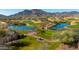 Aerial view of golf course community with mountain backdrop at 20473 W Park Meadows Dr, Buckeye, AZ 85396