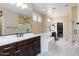 Modern bathroom with double vanity, garden tub, and walk in shower at 20473 W Park Meadows Dr, Buckeye, AZ 85396