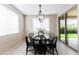 Charming breakfast nook with a black table and chairs at 20473 W Park Meadows Dr, Buckeye, AZ 85396