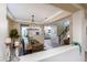 Open concept dining room with wood table and view into living room at 20473 W Park Meadows Dr, Buckeye, AZ 85396