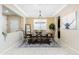 Dining room with wood table, bench seating, and a large chandelier at 20473 W Park Meadows Dr, Buckeye, AZ 85396