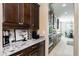 Spacious kitchen with granite countertops and dark wood cabinets at 20473 W Park Meadows Dr, Buckeye, AZ 85396