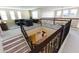 High-angle view of loft overlooking living room and kitchen at 20473 W Park Meadows Dr, Buckeye, AZ 85396