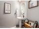 Clean bathroom with pedestal sink, decorative accents and a linen cart at 21720 N 265Th Dr, Buckeye, AZ 85396