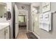 Bathroom with shower, double vanity, and view of bedroom at 21720 N 265Th Dr, Buckeye, AZ 85396